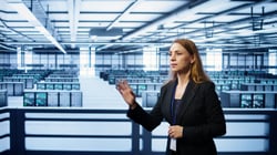 software-developer-looking-holograms-data-center-monitoring-infrastructure